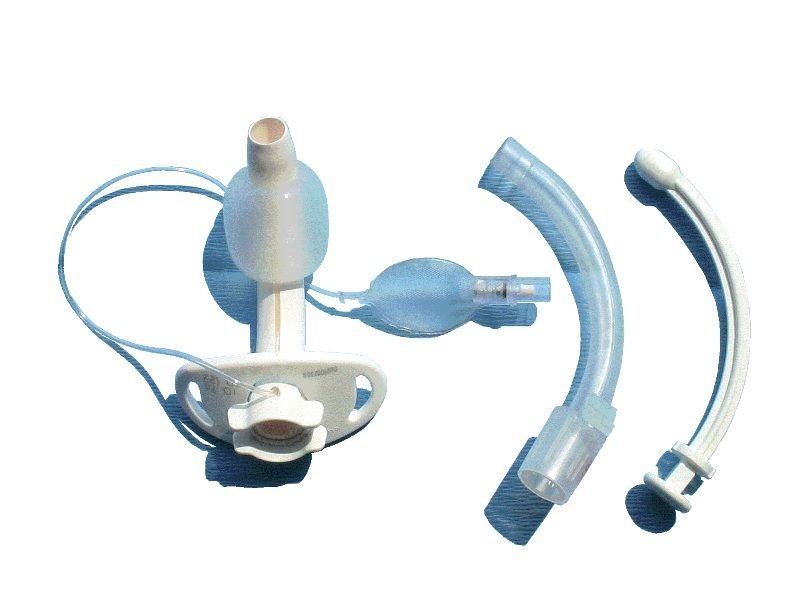Sterile tracheostomy care kit contents including inner cannula cleaning brush, gauze sponges, and suction tray for home airway care in Pakistan
